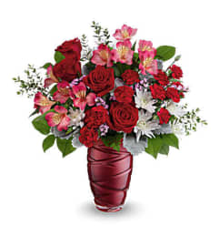 Teleflora's Loving Swirls Bouquet. An arrangement by Michael's Flowers.