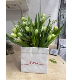 love in a box - Tulips. An arrangement by Chester Florals and Design.