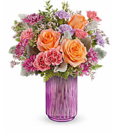 Teleflora's Radiant Joy Bouquet. An arrangement by Michael's Flowers.
