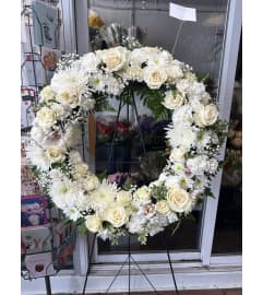 All White Remembrance Wreath. An arrangement by Westdale Florist.