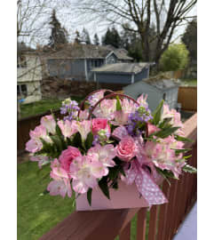 Purse of Flowers. An arrangement by Renton Flower Shop.