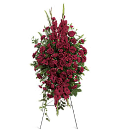 Deepin Our Hearts Spray. An arrangement by Hillcrest Florist.