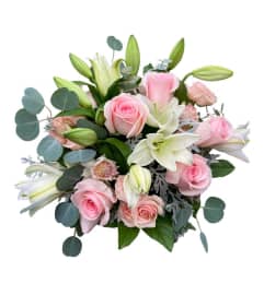 Soft Rose Whispers. An arrangement by Hillcrest Florist.