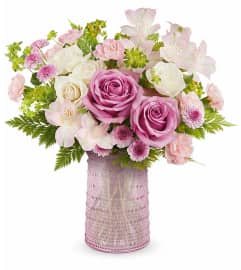 Blush Blossoms Bouquet (Teleflora). An arrangement by North Liberty Flower Shop.