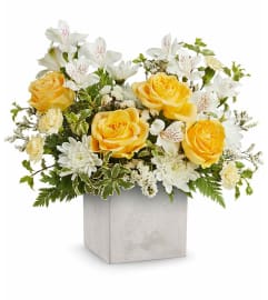 Contemporary Blossoms (Teleflora). An arrangement by North Liberty Flower Shop.
