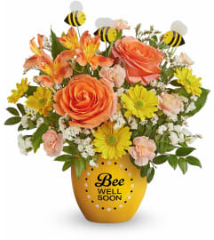 Buzzworthy Blooms (Teleflora). An arrangement by North Liberty Flower Shop.
