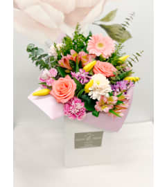 “Take a chance on Me” Handtied. An arrangement by Grande Prairie Florist.