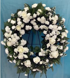 Simple Blessings Wreath. An arrangement by Roma Flowers and Gifts.