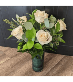 DELUXE WHITE ROSES (1/2 DOZEN, 1 DOZEN and 1.5 DOZEN). An arrangement by Petals and Co..