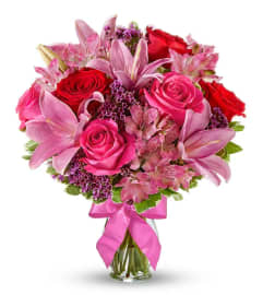 Rose and Lilly Celebration. An arrangement by Tallevast Florist.