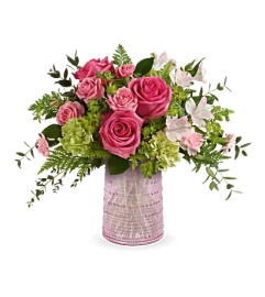 Teleflora's Sparkling Joy Bouquet. An arrangement by Mae's Flowers and Gifts.