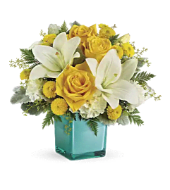 Teleflora's Golden Laughter. An arrangement by Mae's Flowers and Gifts.