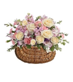 Pastel Dreams Basket. An arrangement by Geni's Florist and Gifts. Pastel Dreams Basket. An arrangement by Geni's Florist and Gifts.