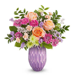 Teleflora's Pretty Glow Bouquet. An arrangement by Michael's Flowers.