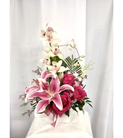 Love You Mom. An arrangement by Commerce Flowers.