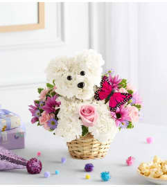 Precious Pup. An arrangement by Palmetto Gardens Florist.