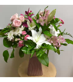 Pink Skirt. An arrangement by Roma Flowers and Gifts.
