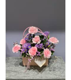Blushing Blooms Bag. An arrangement by Petals.