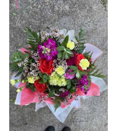 HAND TIED AND WRAPPED BOUQUET. An arrangement by Country Girl Flowers.