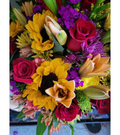Moms The Best. An arrangement by Abundant Flowers and Gift Shoppe.