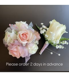 Mini Roses Wrist Corsage Duo. An arrangement by Violeta's Flower Shop.