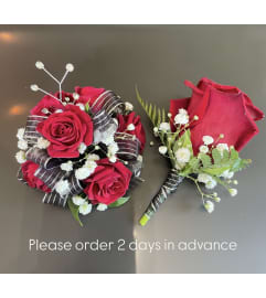 Red Mini Roses Wrist Corsage Duo. An arrangement by Violeta's Flower Shop.