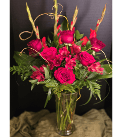 Radiant Red Elegance. An arrangement by Passiflora Creations LLC.
