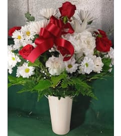 CRIMSON and CREAM. An arrangement by Howard Beach Florist.