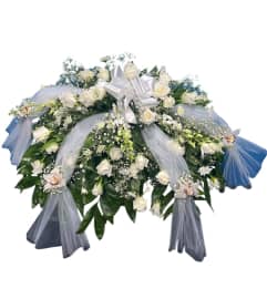 Pure Serenity Blooms Casket Spray. An arrangement by Cinderella's Flowers.