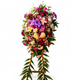 Blossoms of Grace Standing Spray. An arrangement by Cinderella's Flowers.