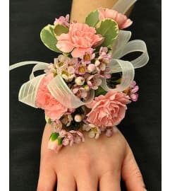 Wedding or prom delicate pink mini carnations on wrist corsage. An arrangement by Timp Valley Floral.