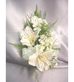 Wedding or prom Peruvian lily wrist corsage. An arrangement by Timp Valley Floral.