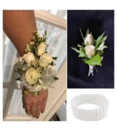 Perfect Pair Roses Wristlet and Boutonierre. An arrangement by In Bloom.