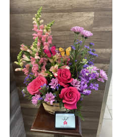Butterfly Garden Basket. An arrangement by Sonia's Florist.