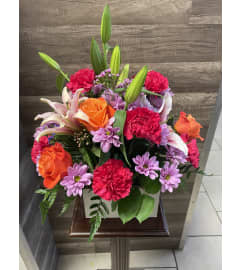 Radiant Garden Arrangement. An arrangement by Sonia's Florist.