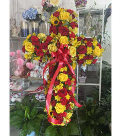 Red and Yellow Standing Cross Tribute. An arrangement by Sonia's Florist.