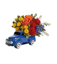 Teleflora's Ford Vintage Truck Bouquet. An arrangement by Believe Flowers.