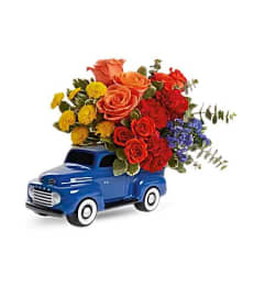 Teleflora's Ford Vintage Truck Bouquet. An arrangement by Believe Flowers.