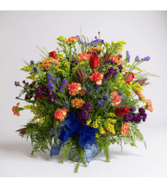 Into the wildflowers tribute. An arrangement by Rustic Floral and Gifts.