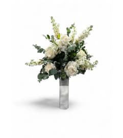 Whispering Blooms Table Centerpiece. An arrangement by Cinderella's Flowers.