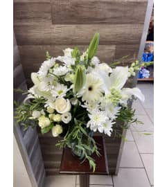 White Meadow. An arrangement by Sonia's Florist. White Meadow. An arrangement by Sonia's Florist.