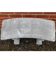 Stone Bench - Cardinals Appear. An arrangement by Tom Rodgers Flowers.
