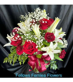 Fellows Crimson Beauty. An arrangement by Fellows Fernlea Flowers. Fellows Crimson Beauty. An arrangement by Fellows Fernlea Flowers.