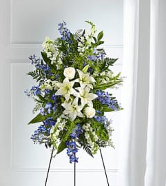 Faithful Friend Easel Spray. An arrangement by North Liberty Flower Shop.