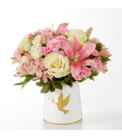 Gentle Healing by FTD. An arrangement by North Liberty Flower Shop.