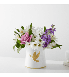 Garden of Peach by FTD. An arrangement by North Liberty Flower Shop.