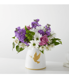 Garden of Peach by FTD. An arrangement by North Liberty Flower Shop.