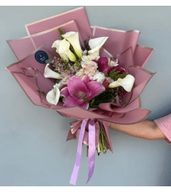 Blush and Grace Bouquet. An arrangement by Blue Iris Florist.