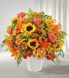 Harvest Thoughts Floor Basket. An arrangement by North Liberty Flower Shop.