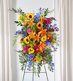 Sunlit Memories Easel Spray. An arrangement by North Liberty Flower Shop.